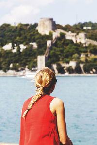 Rear view of woman looking at river