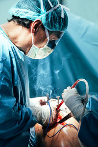 Midsection of man with arms outstretched