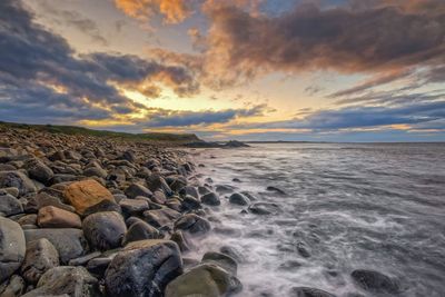 Scenic view of sea against sky during sunset