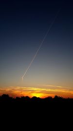 Silhouette landscape against sky during sunset