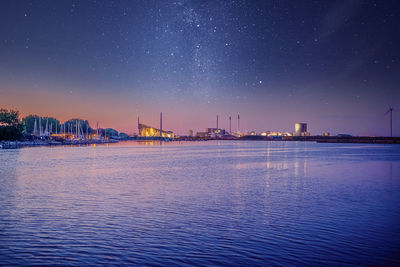 Sea bay of the night sky and the stars of the milky way. copenhagen, denmark