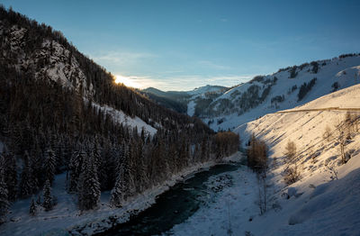 Scenic view of snow covered mountains against sky