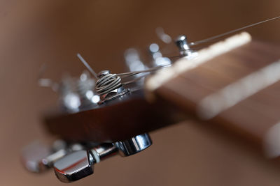 Close-up of guitar on table