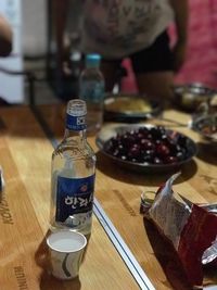 Close-up of wine bottles on table