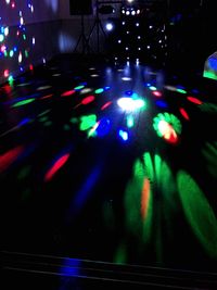 Multi colored lights on floor at night