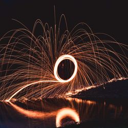 Light trails against sky at night