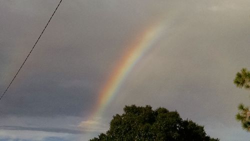 Low angle view of rainbow against sky