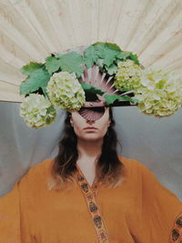 Portrait of woman with potted plants