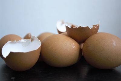 Close-up of eggs against white background