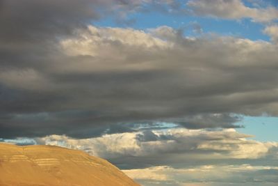 Low angle view of land against sky