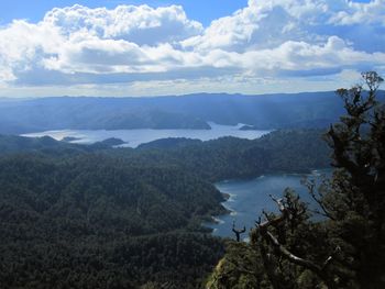 High angle view of land and mountains against sky