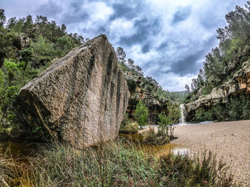 Panoramic shot of rocks on land against sky