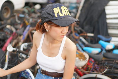 Young woman looking away while sitting in bus