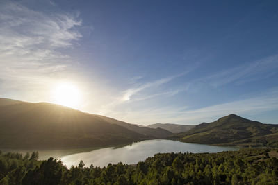 Scenic view of landscape and mountains against sky