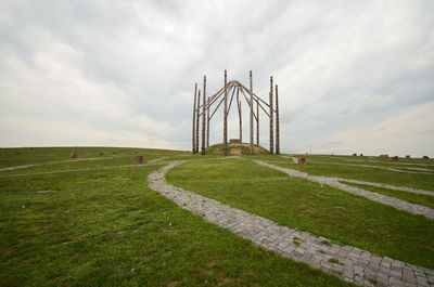 Scenic view of landscape against cloudy sky