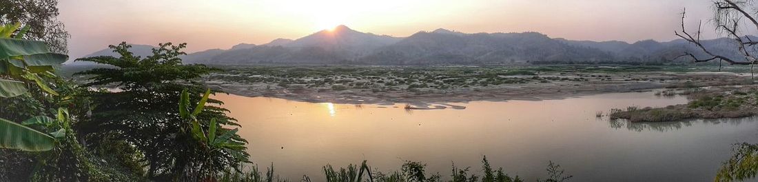 Scenic view of sunset over river