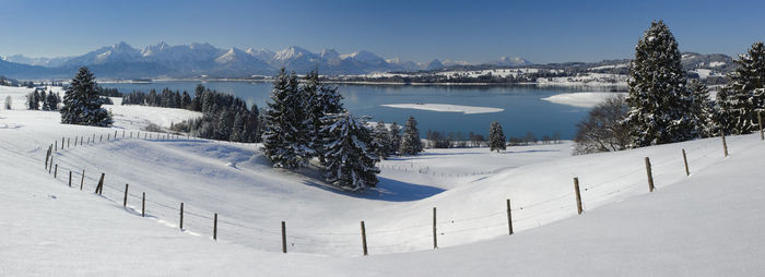 Scenic view of snow covered mountain against sky