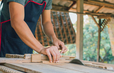 Midsection of man working at table