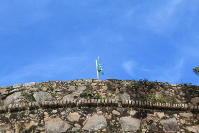 Low angle view of fort against blue sky