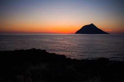 Scenic view of sea at sunset