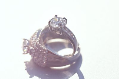 High angle view of wedding rings on white background