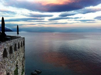 Scenic view of sea against sky at sunset