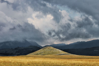 View of landscape against cloudy sky