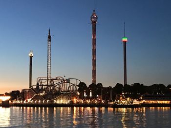 View of illuminated city against clear sky