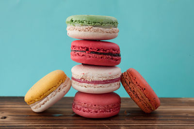 Close-up of cupcakes on table against blue background