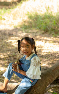 Portrait of cute girl on land