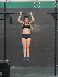 Woman training in the bar in the gym