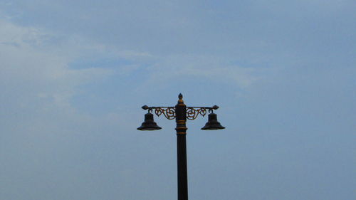 Low angle view of street light against sky