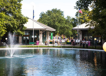 Group of people by swimming pool in lake