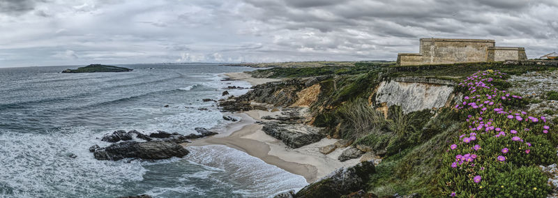 Scenic view of beach against sky