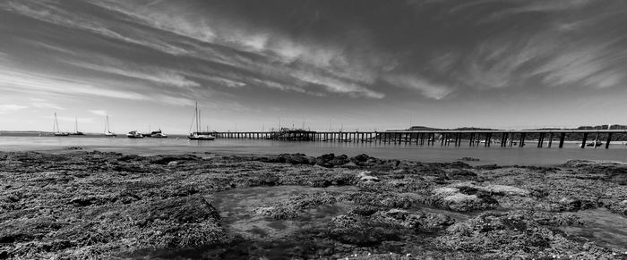 Pier over sea against sky