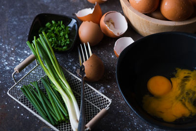 Close-up of egg in pan by vegetables