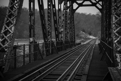 Railroad tracks along bridge