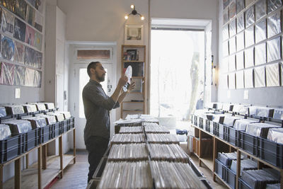 Young man shopping for records