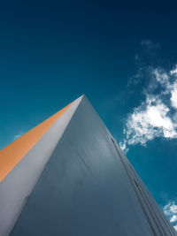 Low angle view of building against cloudy sky