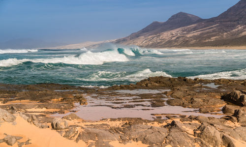 Scenic view of beach against sky