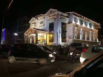 Cars parked on street at night