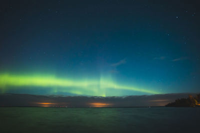 Scenic view of sea against sky at night