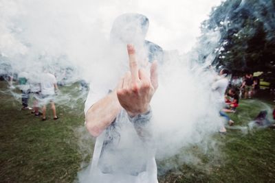 Man making obscene gesture at park