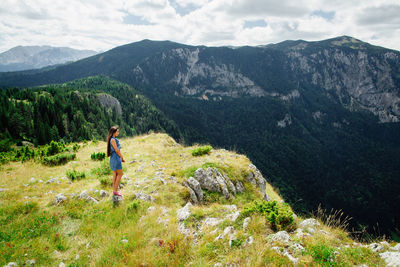 Full length of woman in mountain landscape 