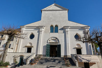 Low angle view of building against clear blue sky