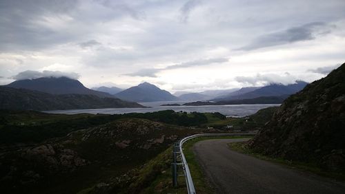 Scenic view of mountain road against sky