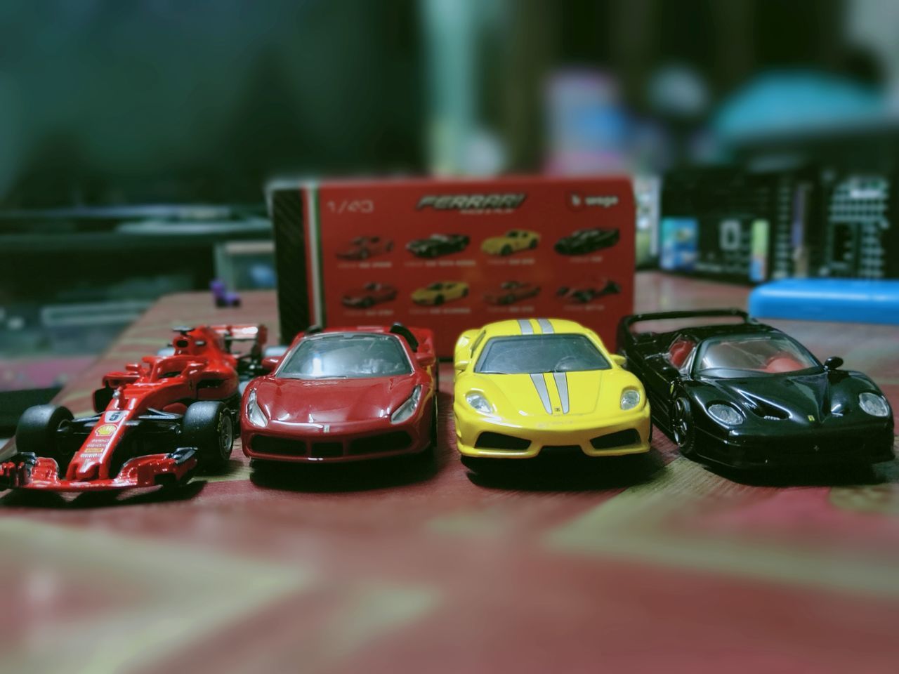 CLOSE-UP OF TOY CAR ON TABLE AT HOME