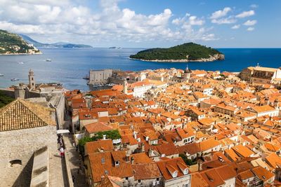 High angle view of cityscape by sea