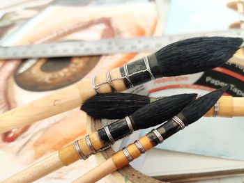 High angle view of paintbrushes on table