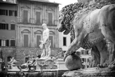 Low angle view of statue against building 